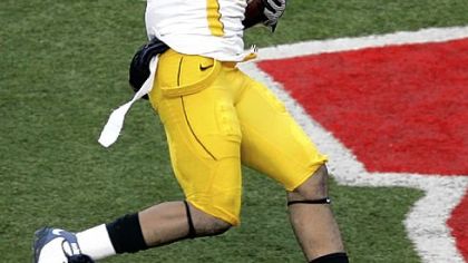 Sidney Glover's interception return for touchdown pushed West Virginia's lead to 21-3 in the third quarter.
