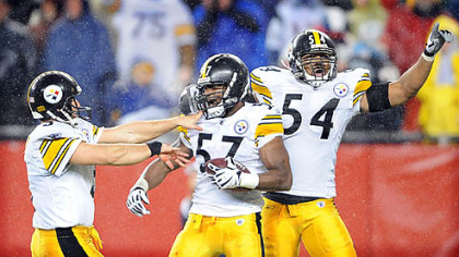 Steelers special teamer Keyaron Fox, center, celebrates after recovering a fumble by the Patriots' Matthew Slater on a kickoff in the third quarter on Nov. 30.